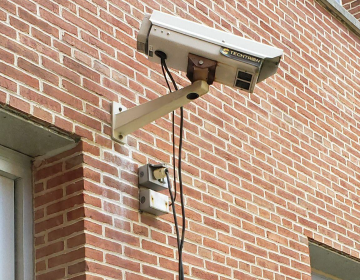 Security camera on a brick wall