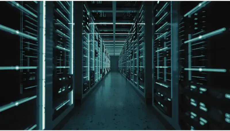 A futuristic data center corridor with server racks and blue neon lighting.